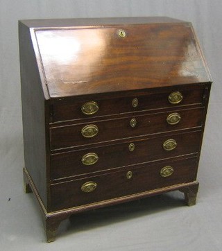 A Georgian mahogany bureau, the fall front revealing a well fitted interior above 4 long graduated drawers with brass drop handles, raised on bracket feet 36"