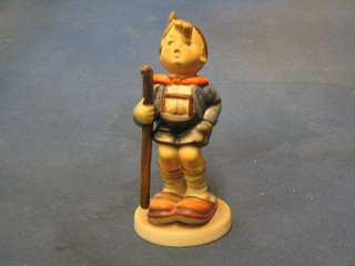 A Goebal figure of  a boy with large walking stick, base marked Goebal 16/4 6"