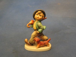 A Goebal figure of a boy with umbrella and dog, base marked 5, 4"