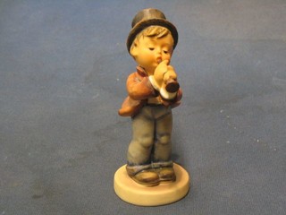 A Goebal figure of a boy with musical instrument base marked 58/0 5"