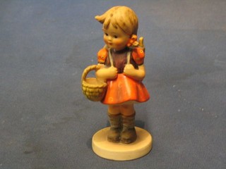 A Goebal figure of a girl with knapsack and basket, base marked 81/0 5"