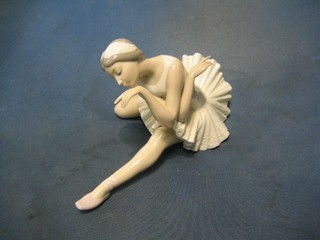 A Lladro figure of a seated ballet dancer, base impressed F29E 9"