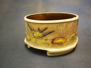A Victorian circular Bretby pottery bowl decorated diving doves, raised on 3 bracket feet, the base marked Bretby England 3125H (crack to side) 8"