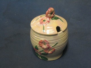 A Malingware pink lustre and floral decorated preserve jar and cover, the base marked Maling England 529 3"