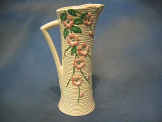 A Malingware (second?) waisted pottery jug with floral decoration, base marked Malingware (struck through) 656YM, 11"