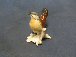 A 20th Century Continental porcelain figure of a seated bird, base marked ENS 3 1/2"