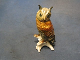 A 20th Century Continental porcelain figure of a seated owl 6"