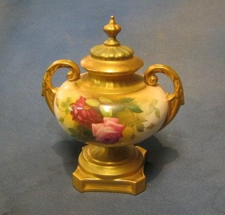 A Royal Worcester twin handled urn and cover with floral decoration, case with purple Royal Worcester mark, 1 star and 3 dots, marked 2296 7"