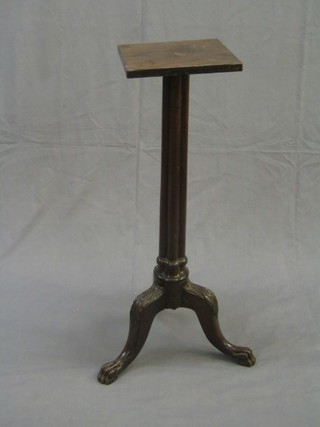 A William IV reeded mahogany torchere, raised on tripod supports