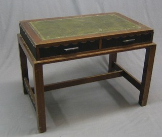 An Art Deco mahogany writing table with inset tooled leather writing surface, the base fitted 2 long drawers, raised on square supports, drawers marked W & G, 40"
