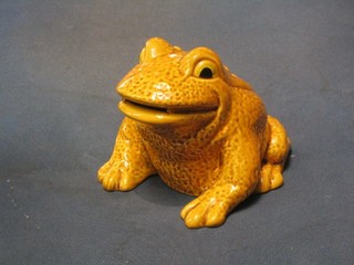 A Sylvac style figure of a yellow glazed seated toad, marked Made in England 438, 5"