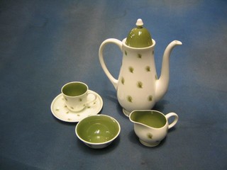 A 14 piece Susie Cooper coffee service comprising circular coffee pot and jar (spout f and r), circular sugar bowl, cream jug (cracked and chipped), coffee pot lid, 6 saucers and 5 cups (1 chipped)