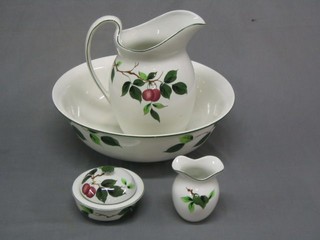A Newport Pottery jug and bowl set complete with soap dish and tooth brush holder and chamber pot painted by T Butler