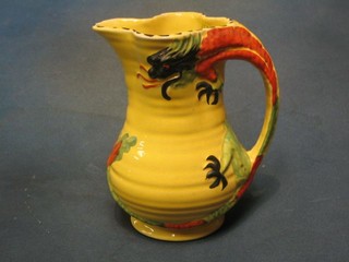 An Arthur Wood pottery jug, the handle in the form of a dragon 7"