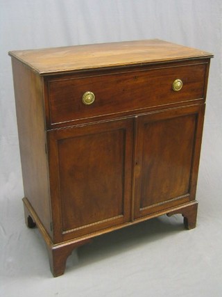 A Georgian mahogany cabinet, the upper section fitted a drawer above a double cupboard raised on bracket feet 37"
