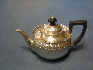 A Victorian circular embossed silver bachelor's teapot with swirl demi-reeded decoration London 1869 7 ozs