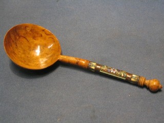 A Russian olive wood spoon with champs leve enamelled decoration to the stem