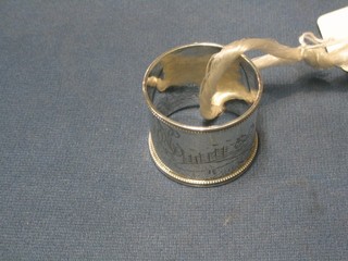 An engraved Russian silver napkin ring with sleighing scene