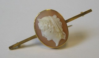 A lady's 9ct gold bar brooch set a shell carved cameo portrait