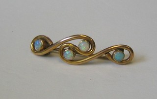 A lady's 9ct gold bar brooch set 4 opals