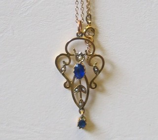 An Edwardian lady's 9ct gold pendant set blue stones and demi-pearls hung on a fine chain