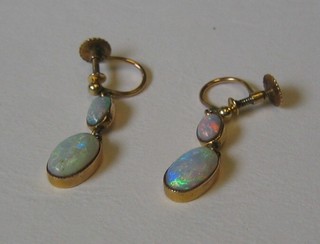 A pair of 9ct gold screw earrings set opals