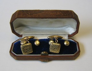 A pair of 9ct gold barked cufflinks and 4 matching dress studs, cased