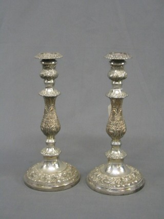 A pair of silver plated Rococo style candlesticks 12"