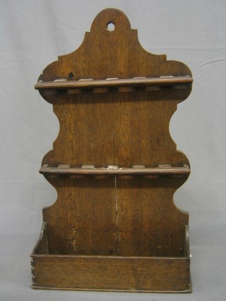 An 18th Century rustic oak spoon rack 23"