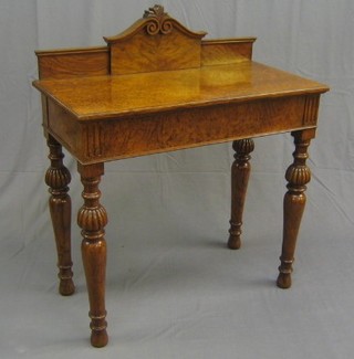 A Victorian Pollard oak side table  with carved raised back, on turned and bulbous supports 36"