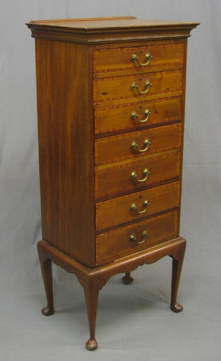 An Edwardian inlaid mahogany music chest fitted 7 long drawers, raised on cabriole support 20 1/2"