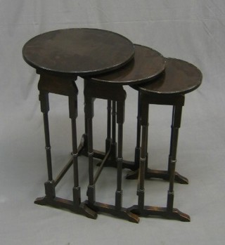 A nest of 3 round mahogany interfitting coffee tables 17"