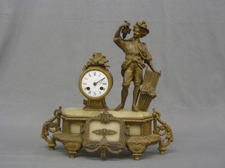 A 19th Century French 8 day striking clock with painted dial and Arabic numerals contained in a gilt spelter case decorated a grape picker