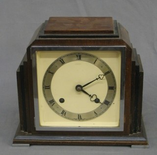 A 1930's Imperial 8 day striking mantel clock with silvered chapter ring, contained in a stepped mahogany case