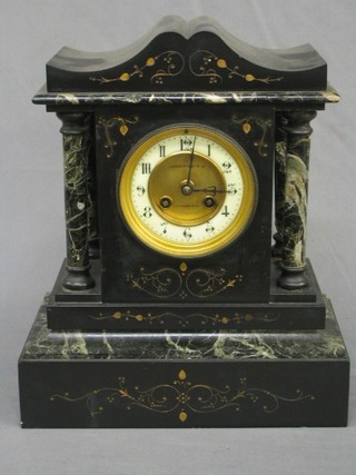 A Victorian French 8 day striking mantel clock with porcelain dial and Arabic numerals contained in a 2 colour marble architectural case