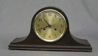 A 1930's chiming mantel clock with silvered dial and Arabic numerals contained in an Admiral's hat shaped case