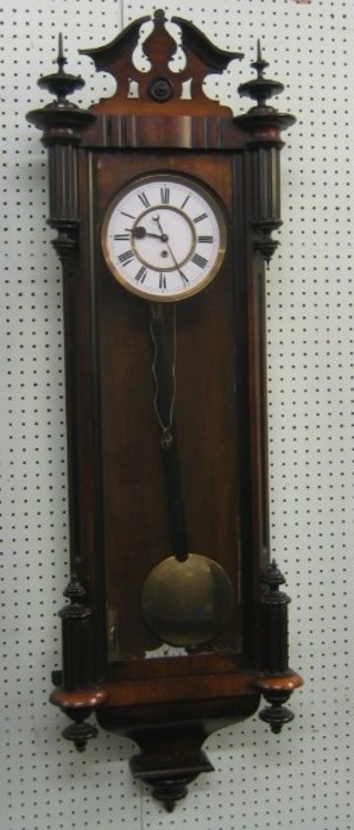 A 19th Century Vienna style regulator, the 7" circular dial with Roman numerals (some cracks) contained in a walnut case
