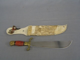 A reproduction Bowie knife with 10" blade and brass and turned wooden grip with eagle pommel, by Tramontinox, contained in a hide scabbard