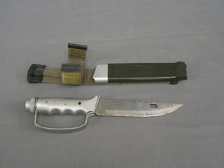 A reproduction Commando knife with 6 1/2" serrated blade by Rostfrei