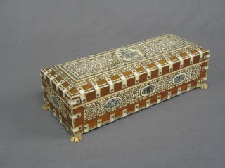 A fine quality 19th Century Eastern hardwood and ivory banded trinket box with hinged lid, raised on paw feet 12"