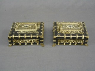 A pair of fine quality 19th Century horn and ivory trinket boxes with hinged lids raised on paw supports 6 1/2"