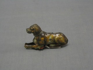 A tin plate model of a dog marked Nero 4 1/2"  and a tin plate clockwork figure of a butterfly 3"