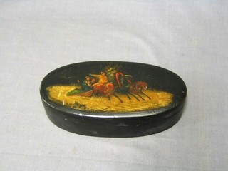 A Russian oval lacquered box, the lid decorated a sleigh scene 7 1/2"