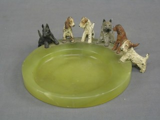 An Art Deco circular green marble and cold painted bronze ashtray in the form of a pool, the edge with 6 dogs