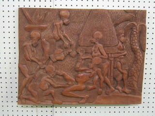A  Camaroon hardwood panel depicting mother in child birth, the reverse marked Henri Fonkak Mailre Artisan/Tsinga Yaounde Camaroon 14" x 18"