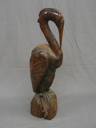 A carved wooden figure of a Pelican 37"