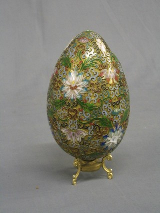 A fine quality 19th Century Champleve enamelled egg, raised on a gilt base 8" (some damage)