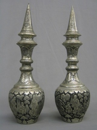 A pair of large and impressive Eastern engraved metal urns and covers of bottle form 22"