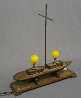 A 1930's wooden table lamp in the form of a yacht 