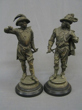 A pair of 19th Century spelter figures of Cavaliers, raised on oval bases 21" (1f)